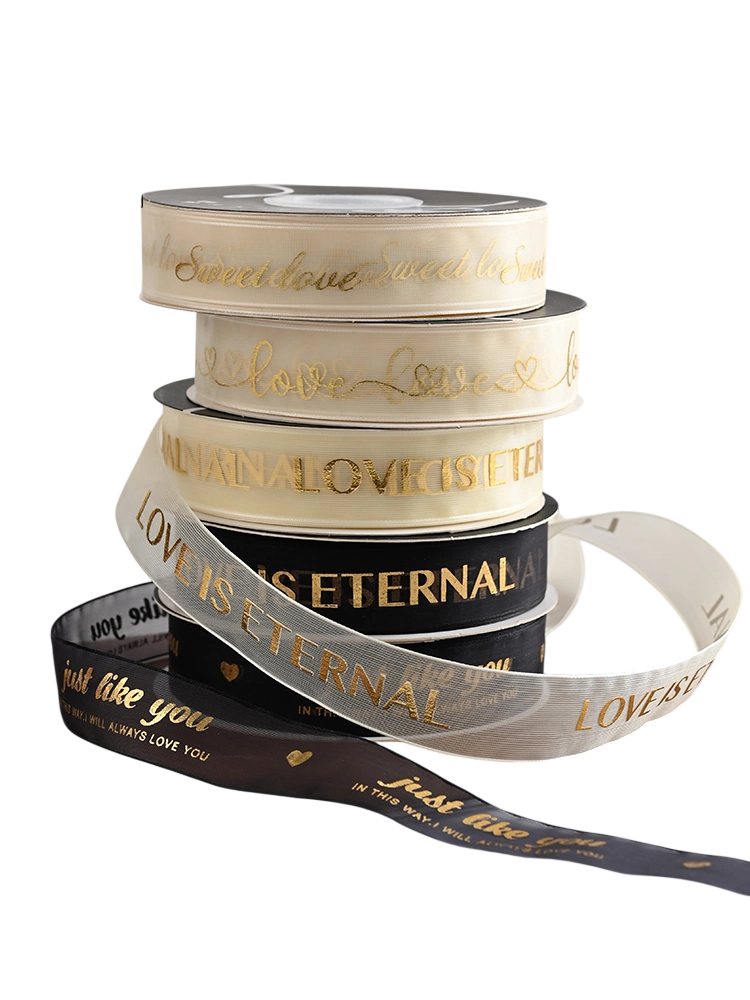 Cuộn ruy băng voan lưới màu kem in kin chữ đồng 2.5cm x 20 yard ảnh 1